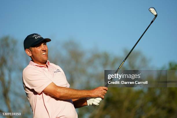 Brendon Todd of the United States plays his shot on the 17th tee in his match against Daniel Berger of the United States during the second round of...