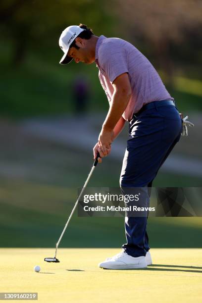 Jon Rahm of Spain prepares to putts on the 16th green in his match against Shane Lowry of Ireland during the second round of the World Golf...