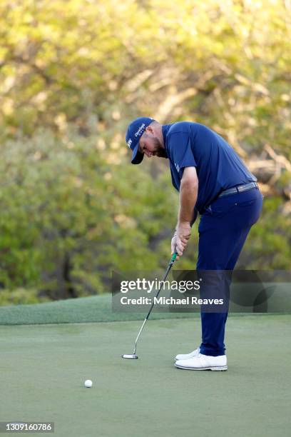 Shane Lowry of Ireland putts on the 17th green in his match against Jon Rahm of Spain during the second round of the World Golf Championships-Dell...