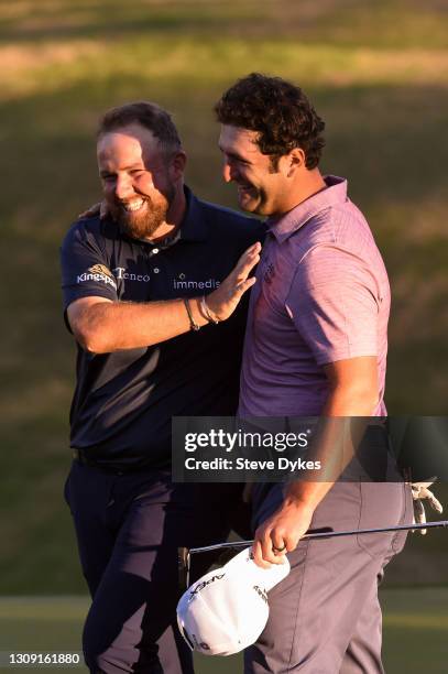 Jon Rahm of Spain shakes hands with Shane Lowry of Ireland after winning their match during the second round of the World Golf Championships-Dell...