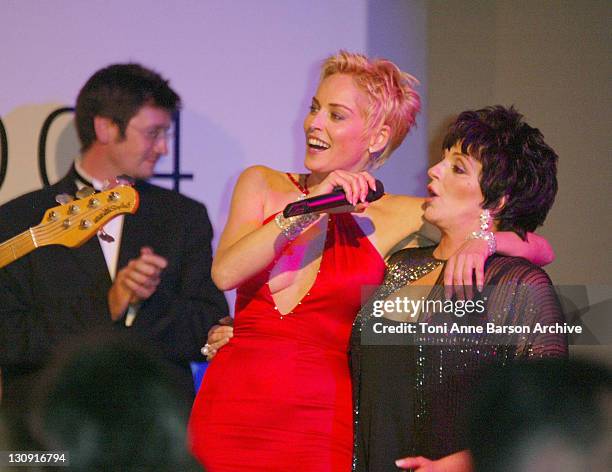 Sharon Stone and Liza Minnelli during amfAR's "Cinema Against AIDS Cannes" benefit. Sponsored by Miramax and Quintissentially - Auction at Moulin De...