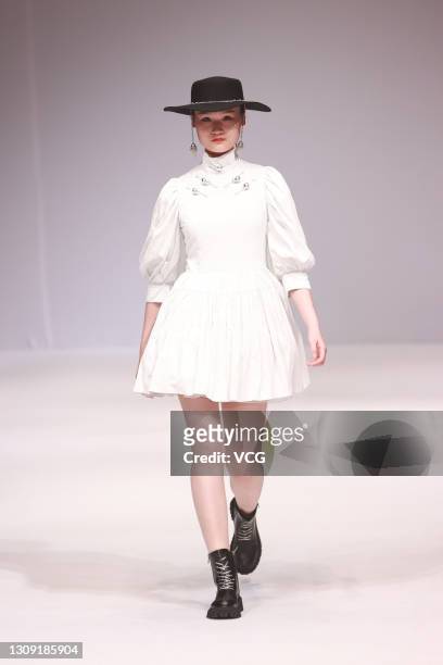 A model walks the runway during the Esa Liang show by BingQin Liang News  Photo - Getty Images