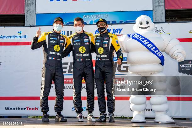 Left to right, Sebastien Bourdais, Loic Duval, and Tristan Vautier pose for a photo before the12 Hours of Sebring, IMSA WeatherTech Series race,...