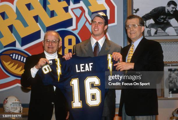 First round draft pick Ryan Leaf of the San Diego Charger poses for this photo with owner Alex Spanos and commissioner Paul Tagliabue during the NFL...