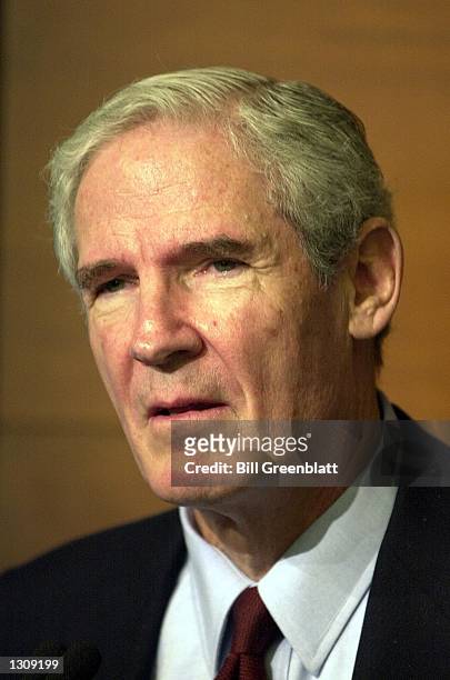 Charles F. Knight, chairman and chief executive officer of Emerson Electric, listens to a question at a press conference where he announced that he...