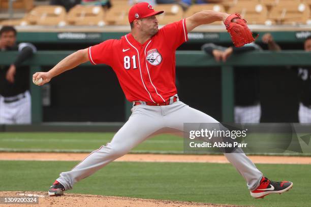 Bo Takahashi of the Cincinnati Reds pitches in the fourth inning against the Chicago White Sox during the MLB spring training game at Camelback Ranch...