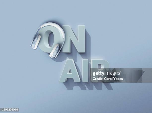 on air red  3d sign with headshet in pastel blue background - on air sign imagens e fotografias de stock