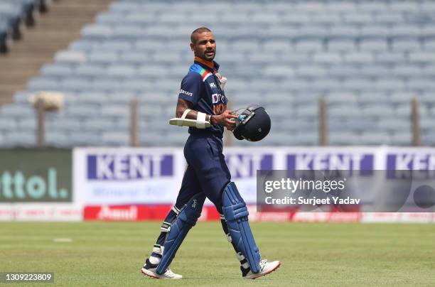 India batsman Shikhar Dhawan leaves the field after being dismissed by Reece Topley for 4 runs during the 2nd One Day International between India and...