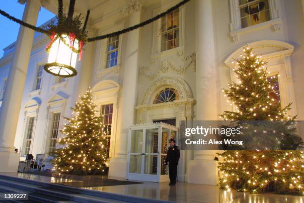 Two decorated Christmas trees stand at the North Portico of the White House December 4, 2000 in Washington. First Lady Hillary Rodham Clinton...