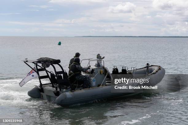 Royal Australian Navy officers are seen aboard a Rigid-Hulled Inflatable Boat on Saibai on March 26, 2021 in Saibai Island, Australia. The RHIBs...
