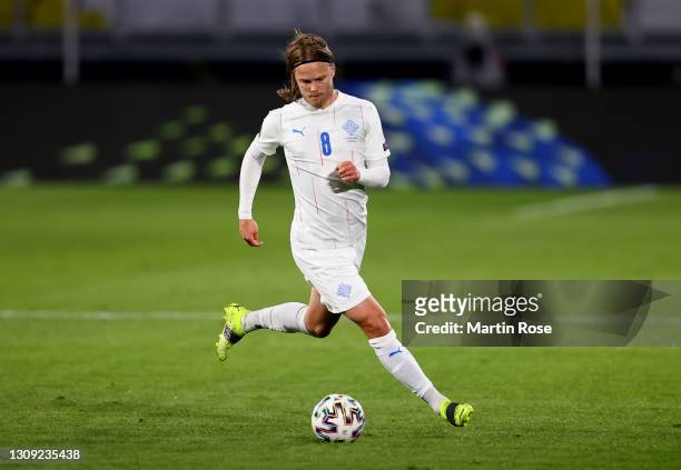 Birkir Bjarnason of Iceland runs with the ball during the FIFA World Cup 2022 Qatar qualifying match between Germany and Iceland on March 25, 2021 in...