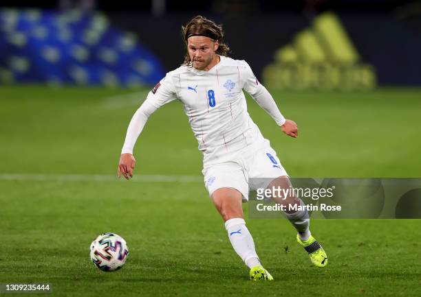 Birkir Bjarnason of Iceland runs with the ball during the FIFA World Cup 2022 Qatar qualifying match between Germany and Iceland on March 25, 2021 in...