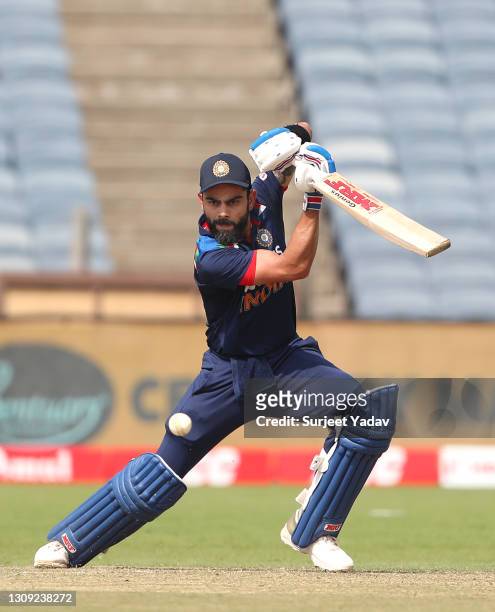 India batsman Virat Kohli cuts a ball for some runs during the 2nd One Day International between India and England at MCA Stadium on March 26, 2021...