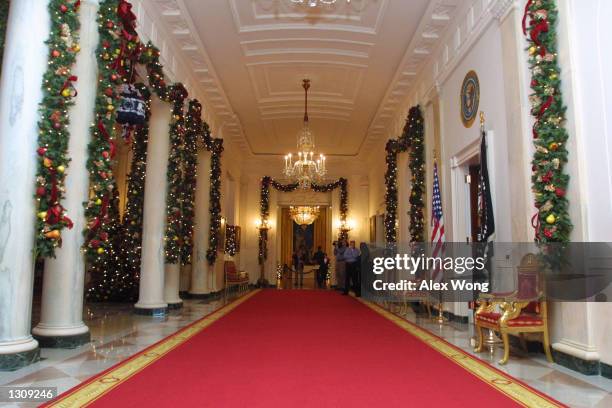 Christmas decorations line the Cross Hall on the State floor of the White House December 4, 2000 in Washington, DC. First Lady Hillary Rodham Clinton...