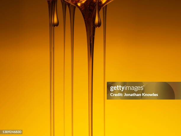 dripping honey - honey stock pictures, royalty-free photos & images