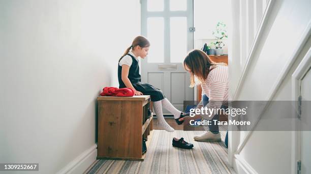 girl getting ready for school - schuhpflege stock-fotos und bilder