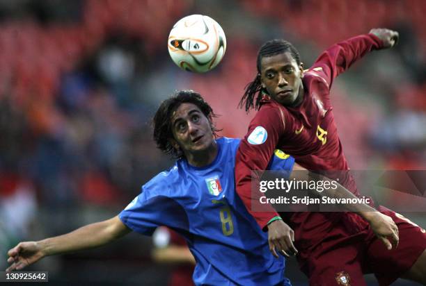 Italy's soccer player Alberto Aquilani, left, battle for the ball with Portugal's Manuel Fernandes, right, during their Olympic 2008 qualifying...