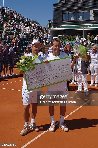 Doubles teammates Jonas Björkman and Thomas Johansson of Sweden during their match against Jose Acasuso and Juan Ignacio from Argentina in the 2006...