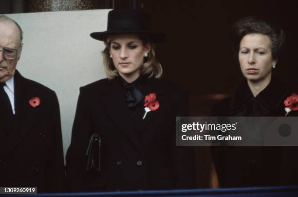 Norwegian Royal Olav V of Norway alongside British Royals Princess Diana and Anne, Princess Royal, each wearing a remembrance poppy, at the...