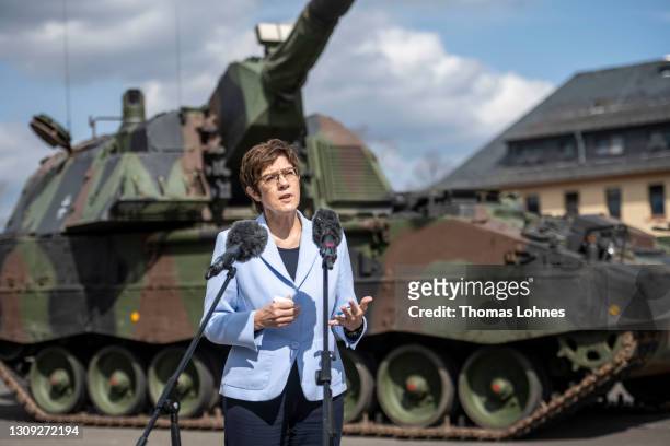 German Defense Minister Annegret Kramp-Karrenbauer speaks to the media in front of a Panzerhaubitze 2000 after she visits the Bundeswehr's training...