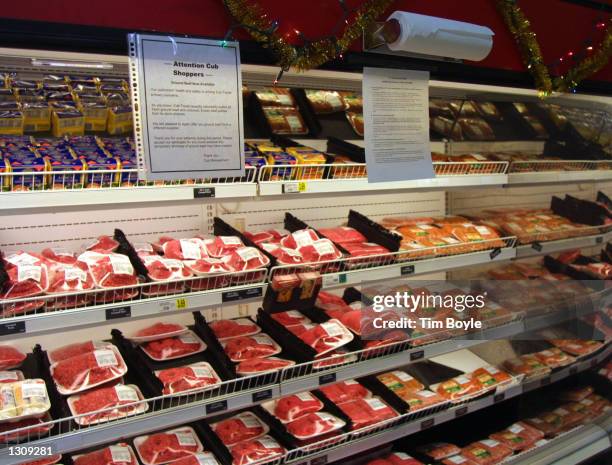 An informational notice regarding replacement ground beef hangs near a food cooler at a Cub Foods grocery store December 4, 2000 in Niles, IL. The...