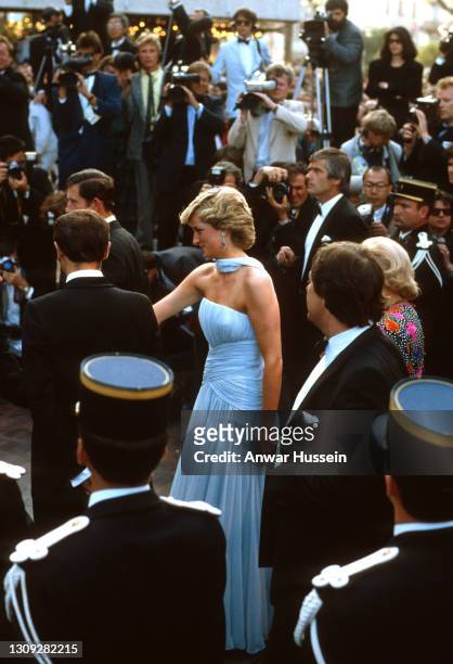 Prince Charles, Prince of Wales and Diana, Princess of Wales, wearing a pale blue silk chiffon strapless dress with a matching chiffon stole designed...