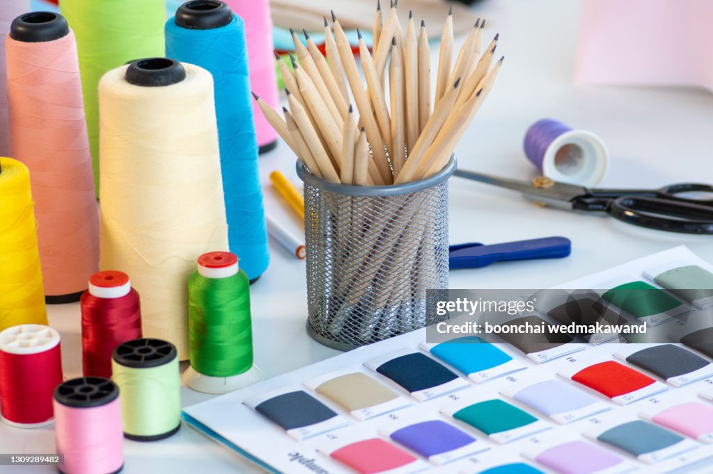 Threads For Sewing And Colourful Fabric Samples High-Res Stock Photo -  Getty Images