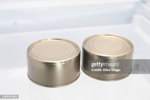 two can of tuna inside a refrigerator. - expiry date stock pictures, royalty-free photos & images