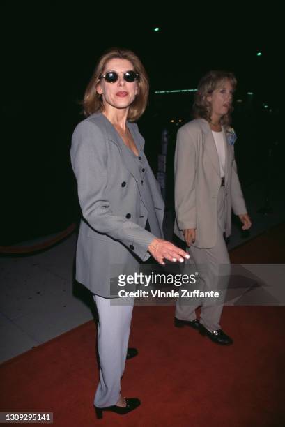 American actress and singer Christine Baranski, wearing a grey jacket with light grey trousers, attends the premiere of 'Michael Collins', held at...