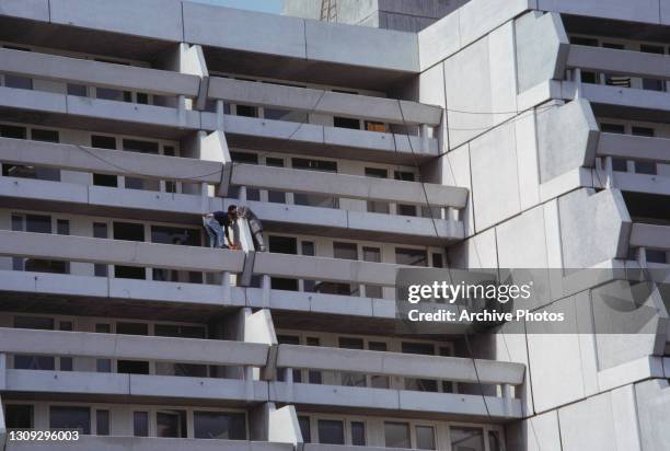 Authorities inspecting a balcony at the scene of the massacre during which eleven members of the Israeli Olympic team were killed by Palestinian...