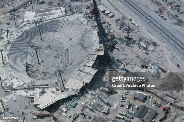 Aerial view showing Olympic Stadium, designed by architect Gunther Behnisch and the engineer Frei Otto, under construction in the Olympiapark as...