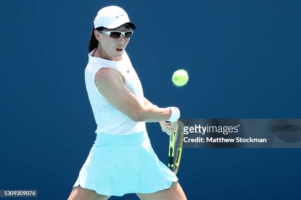 Saisai Zheng of China returns a shot to Karolina Pliskova of Czech Republic during the Miami Open at Hard Rock Stadium on March 26, 2021 in Miami...