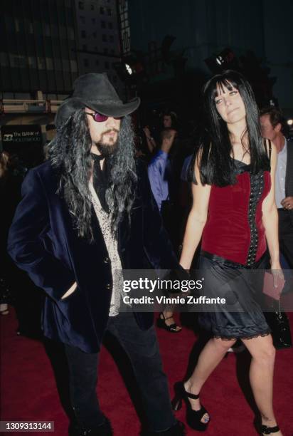 American singer-songwriter and filmmaker Rob Zombie and his partner, American actress Sheri Moon attend the premiere of 'Spawn', held at Mann's...