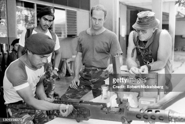 Salvadoran Army soldier receives weapons training on a 50-caliber machine gun from Soldier of Fortune magazine editor and publisher Robert K Brown ,...