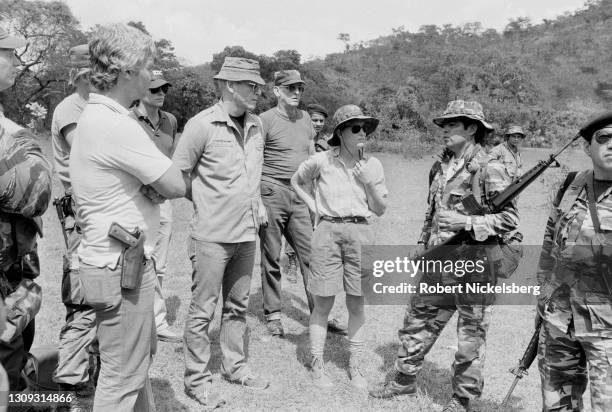 Soldier of Fortune magazine editor and publisher Robert K Brown speaks with a Salvadoran Army soldier, San Francisco Gotera, El Salvador, February...