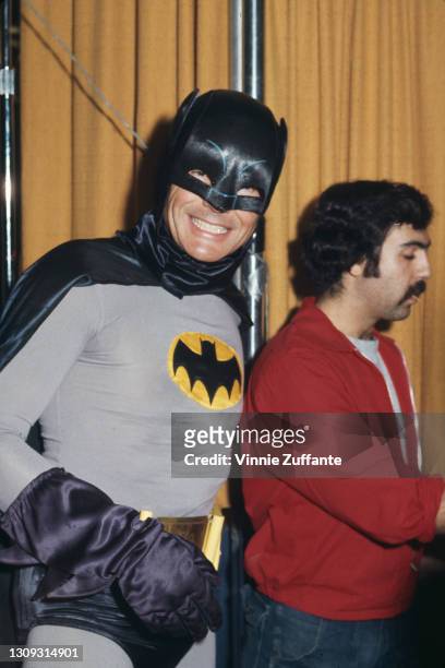 American actor Adam West in costume as 'Batman', the character West played in the 'Batman' television series, at an unspecified location, circa 1980.