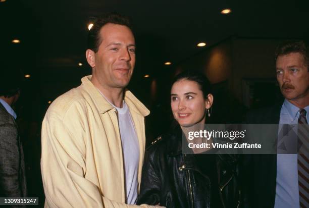 American actor Bruce Willis and his wife, American actress Demi Moore attend the premiere of 'Chances Are' held at the Mann Bruin Theatre in Los...