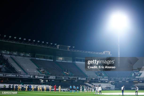 Players line up ahead of the Liga Smartbank match betwen CD Castellon and RCD Espanyol de Barcelona at Nou Castalia on March 26, 2021 in Castellon de...