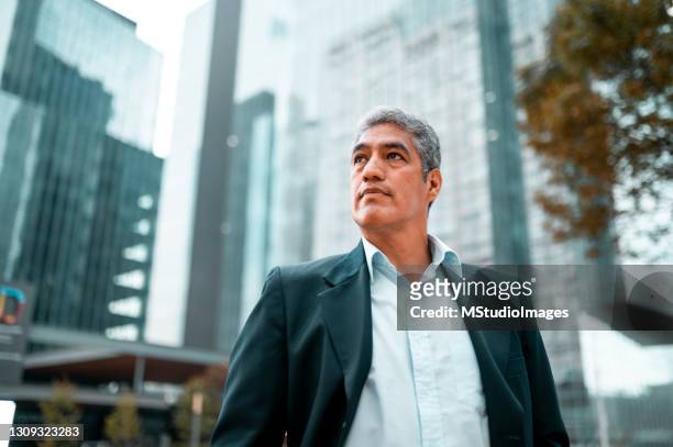 low angle photo of businessman - looking away stock pictures, royalty-free photos & images