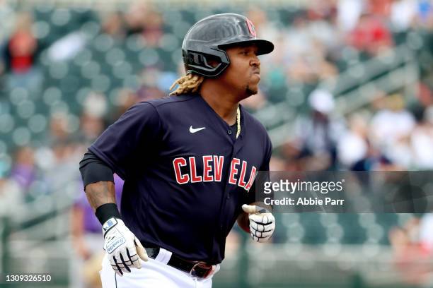 Jose Ramirez of the Cleveland Indians laps the bases after hitting a solo home run in the first inning to take a 1-0 lead against the Colorado...