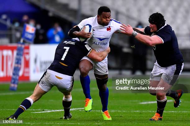 Virimi Vakatawa of France is tackled by Hamish Watson of Scotland during the Guinness Six Nations Rugby Championship match between France and...