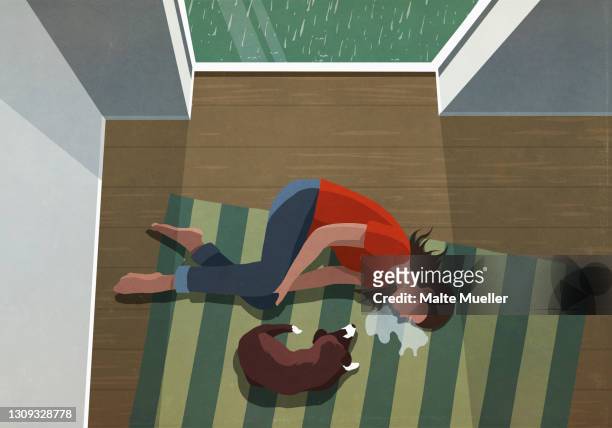 dog laying next to depressed woman crying on floor - grief stock-grafiken, -clipart, -cartoons und -symbole