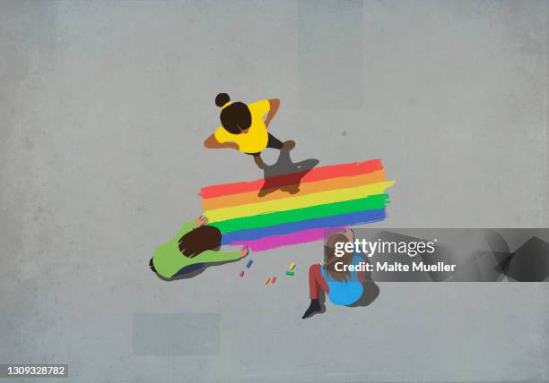 women coloring rainbow with sidewalk chalk - gay person stock illustrations