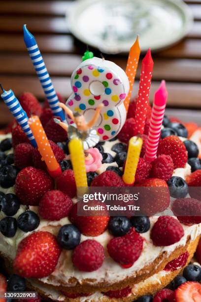 vibrant candles and number 8 candle on fruit birthday cake - creative08 stock pictures, royalty-free photos & images