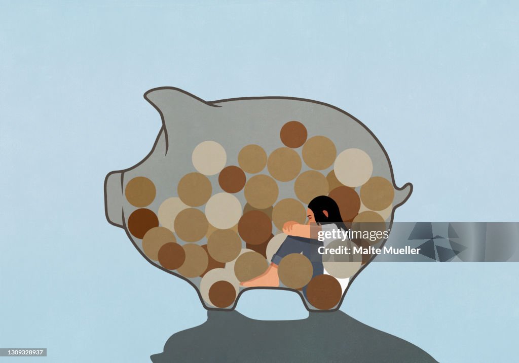 Woman inside piggy bank with coins