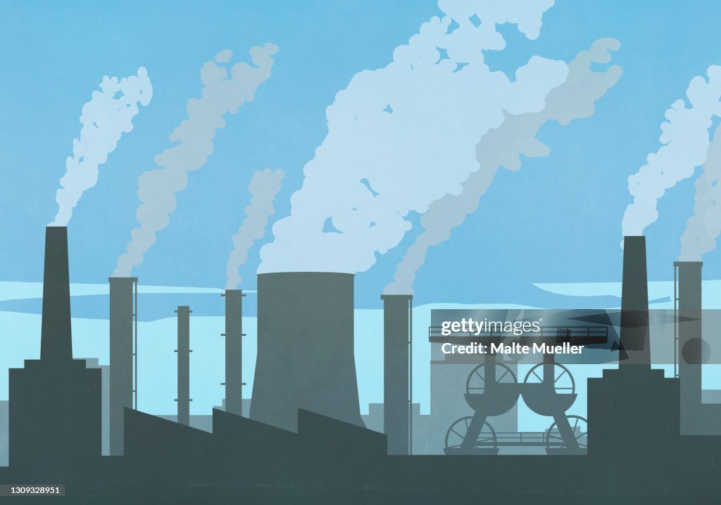 Pollution smoke emitting from factory smokestacks