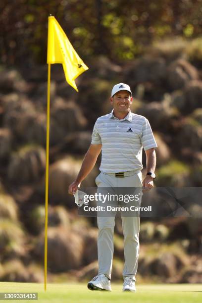 Sergio Garcia of Spain celebrates after hitting a hole in one on the fourth playoff hole in his playoff match against Lee Westwood of England during...