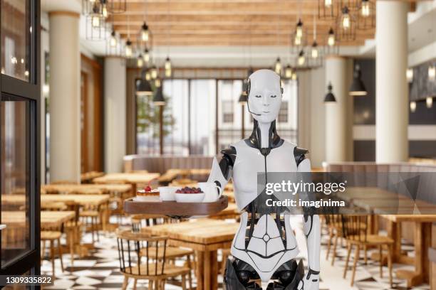 robot waitress serving in a restaurant - robot imagens e fotografias de stock