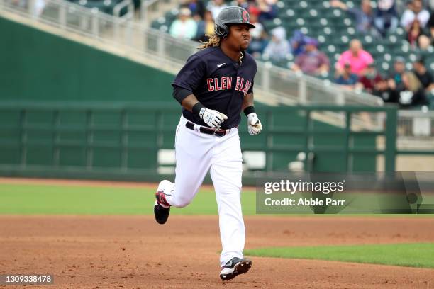 Jose Ramirez of the Cleveland Indians laps the bases after hitting a solo home run in the first inning to take a 1-0 lead against the Colorado...