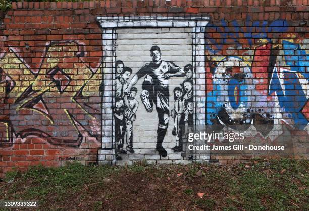 Mural of Manchester United player Marcus Rashford kicking down the door to No10 is seen by a canal near Old Trafford, the home of Manchester United...